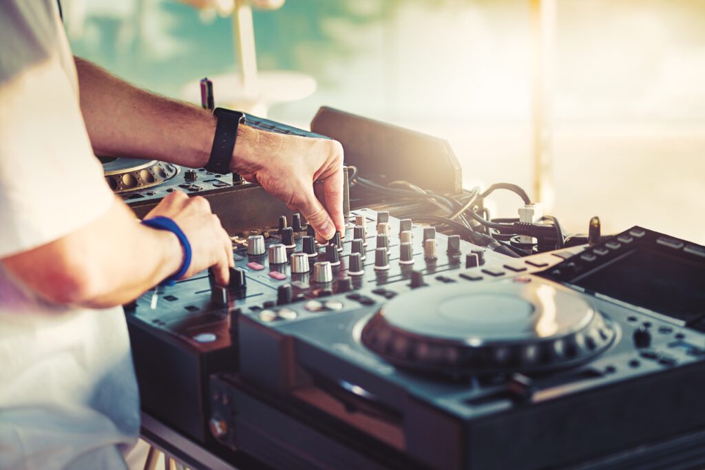 Dj,Is,Mixing,Music,With,Deejay,Controller,At,Outdoor,Summer
